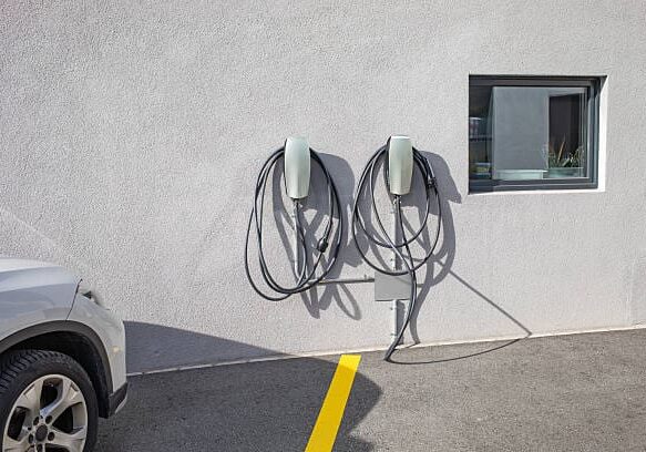 Charging station for electric cars on the outside wall of a building